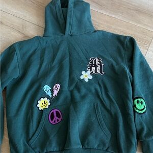 Stylish Green Hoodie with Fun Patches